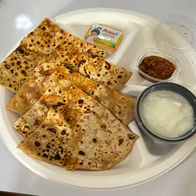 Pyaz Parantha With Curd Butter And Pickle