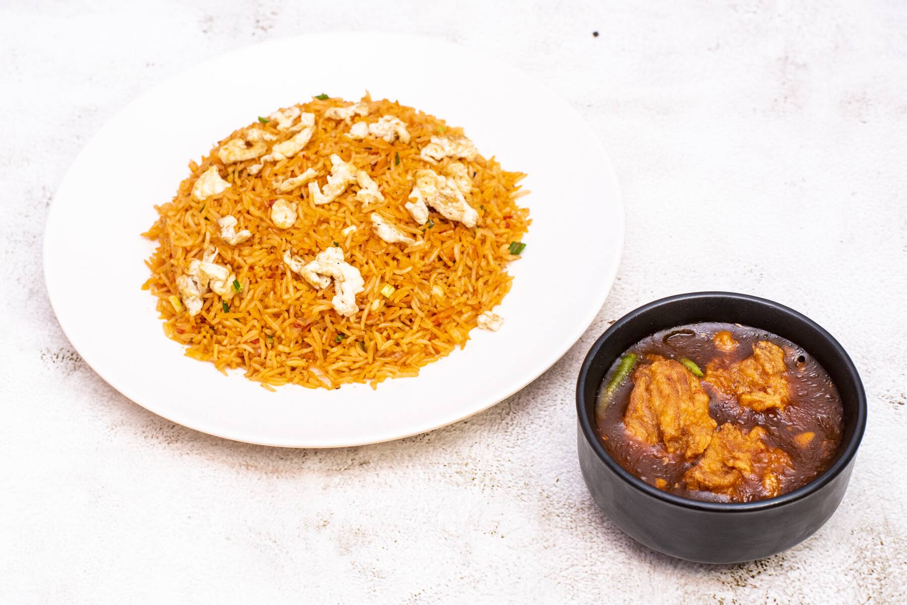 Schezwan Egg Fried Rice With Boneless Chilli Chicken [3 Pieces]