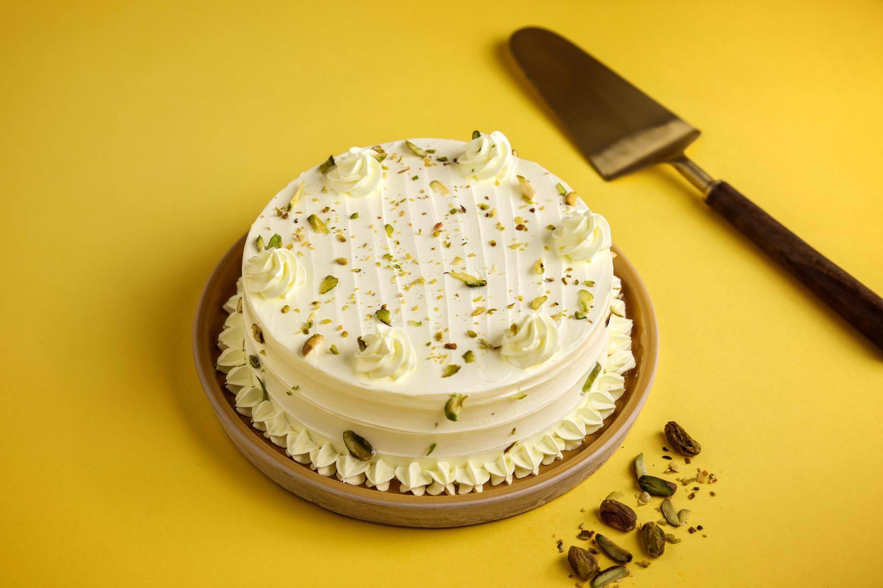 Order Pineapple and Pista Rasmalai Cake Online From munflowersncakes, bangalore