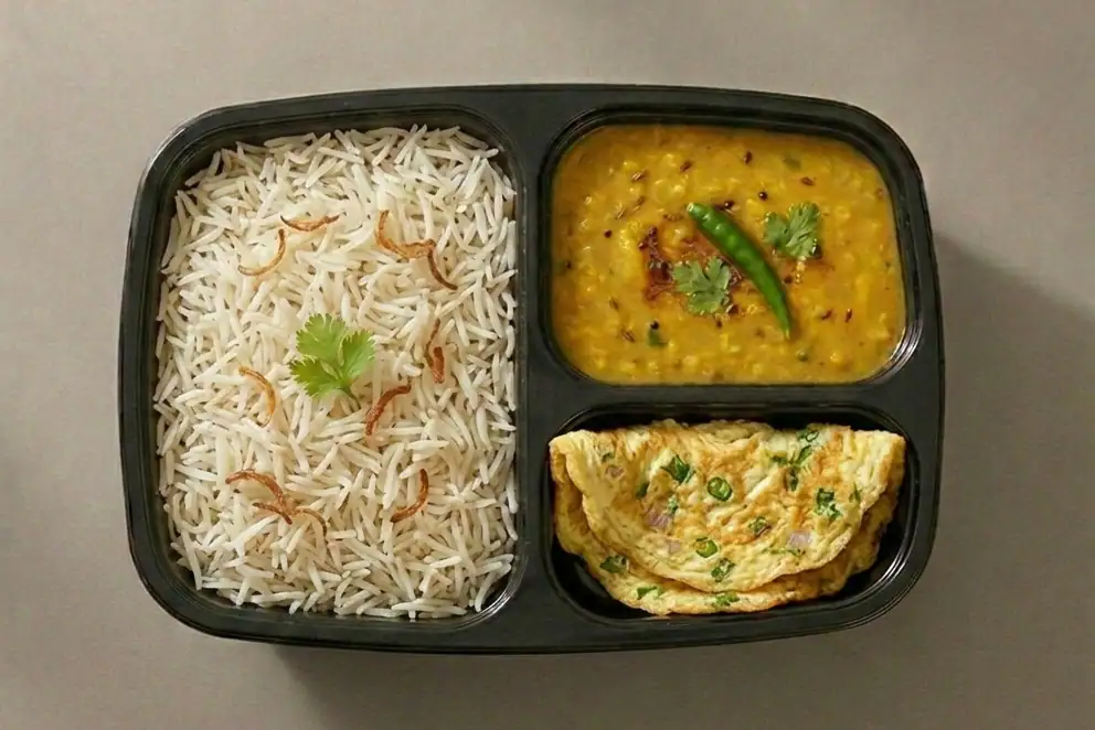 Steamed Rice With Dal And Egg Omelette