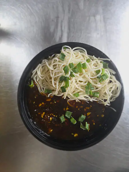 Veg Hakka Noodles With Manchurian Gravy