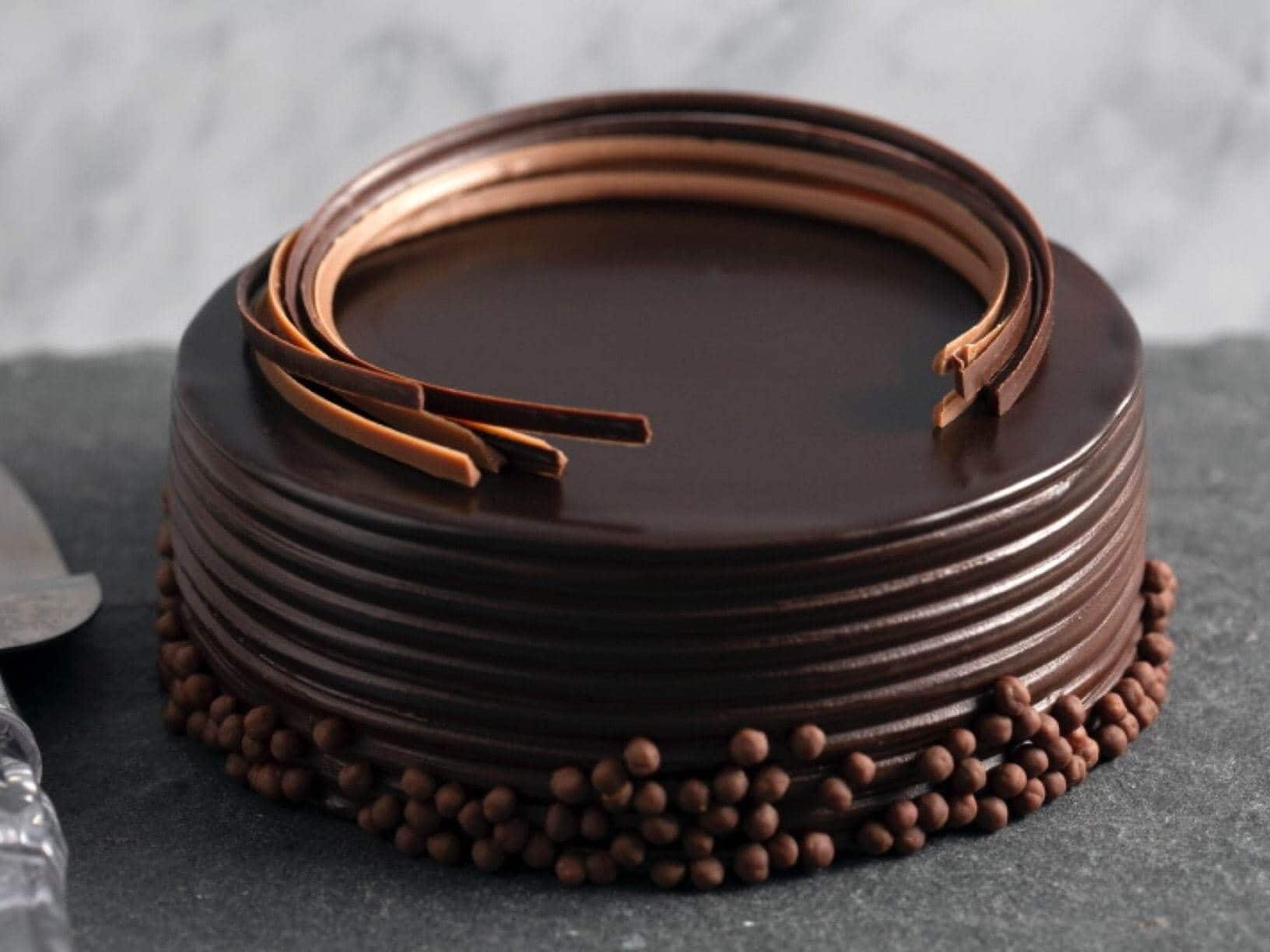 Featured image of post Theobroma Truffle Cake Review With its mushy base and luscious chocolate glaze this chocolate truffle is a drool worthy treat for all the times you wish to gorge on something delicious
