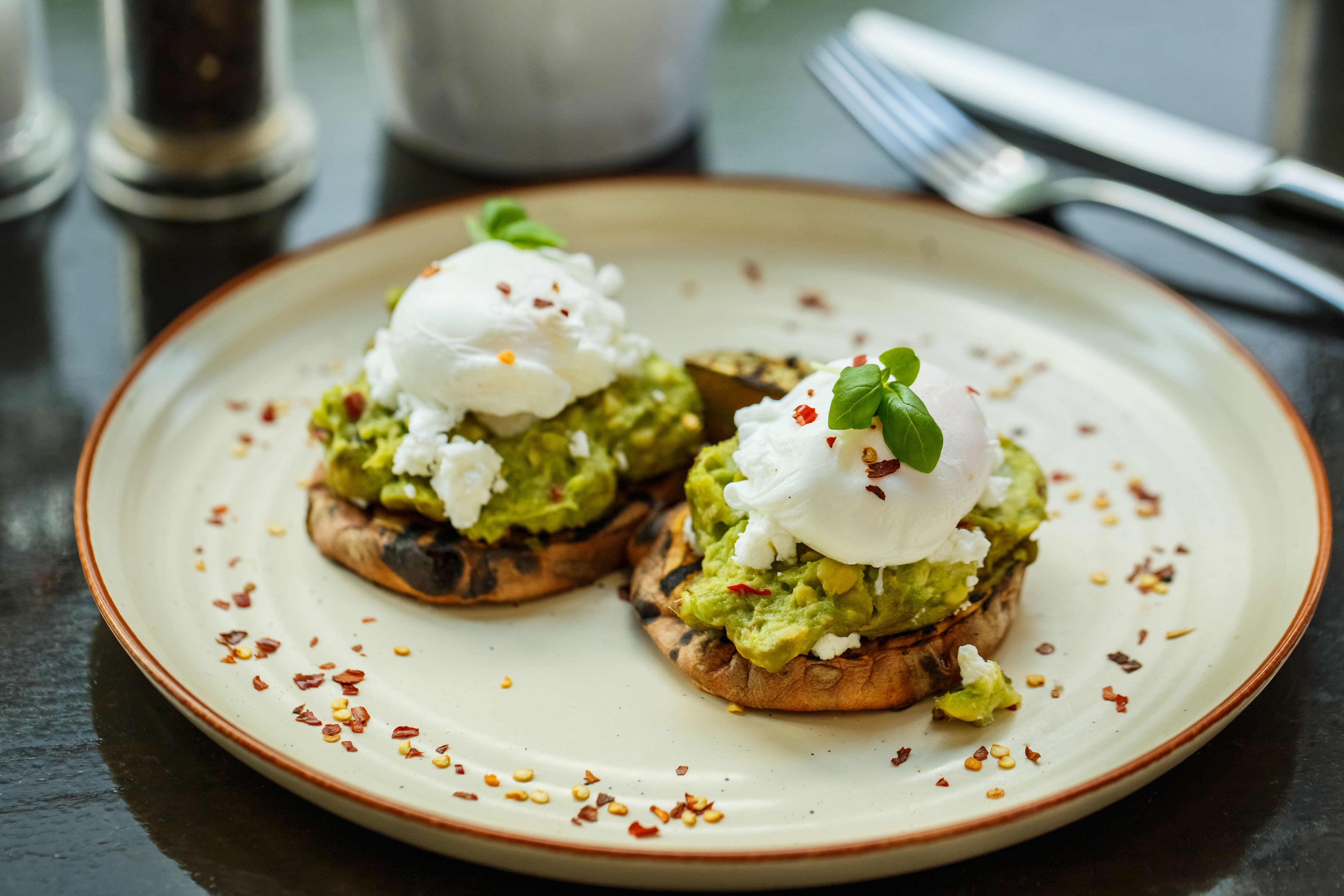 Smashed avocado and poached eggs on toast