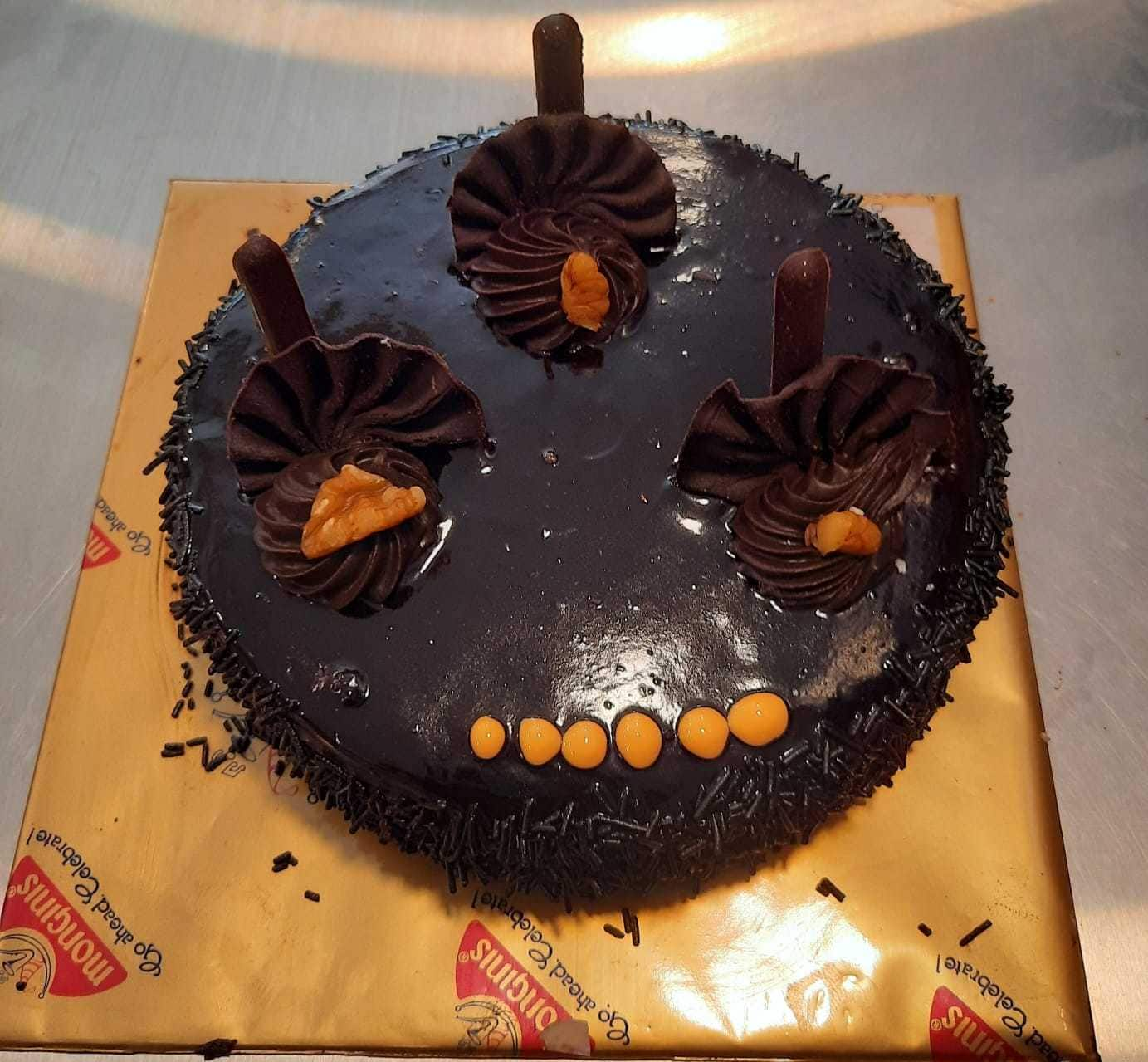 Monginis Mumbai - This dark chocolate truffle cake is... | Facebook