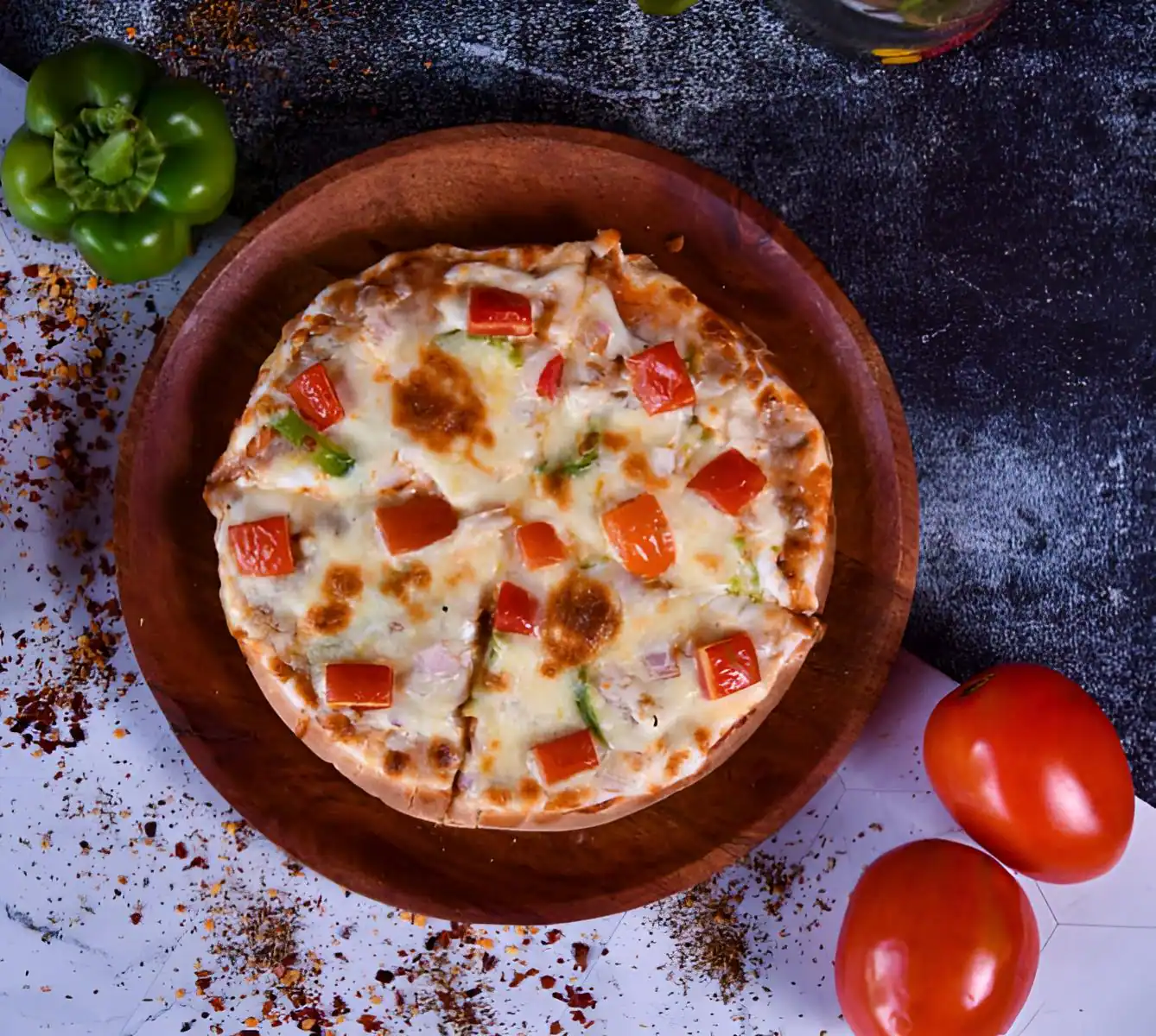 Cheese Onion, Capsicum, Tomato Pizza.