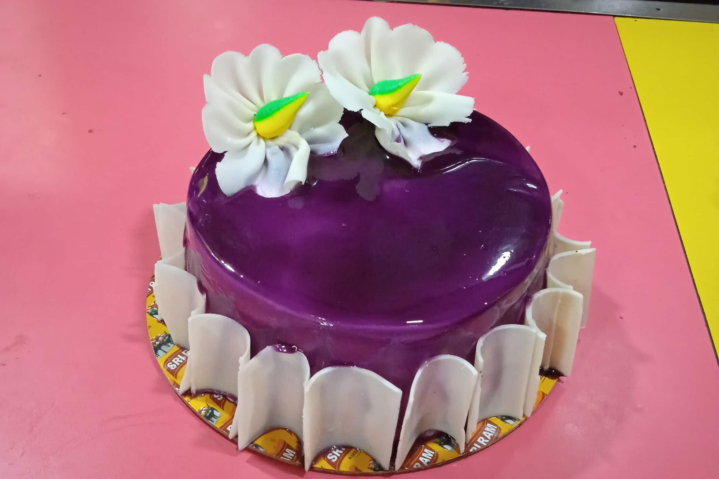 Hat Shaped Birthday Cake with Chlorofram Pump Shoe as Crown Stock Photo -  Alamy