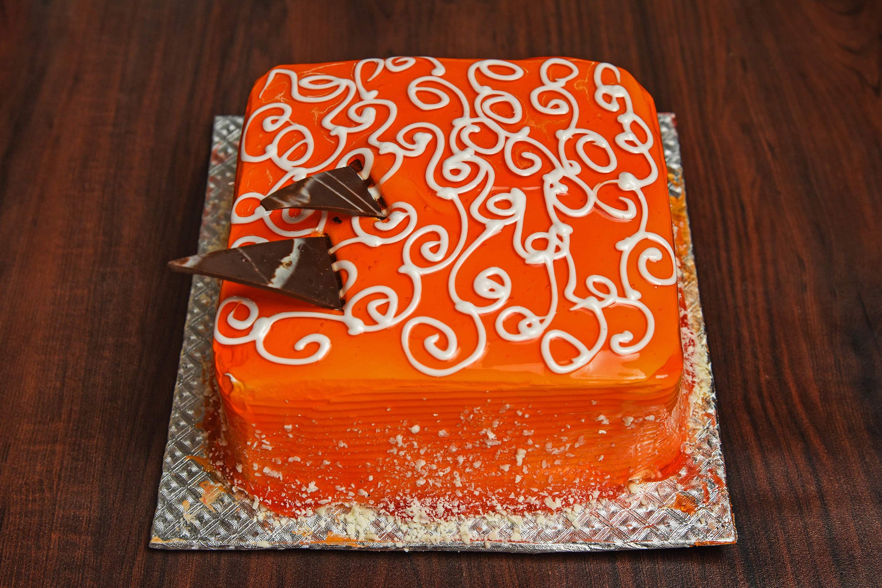 Premium Vector | Cake with orange of orange color. vector flat illustration  of cake with oranges