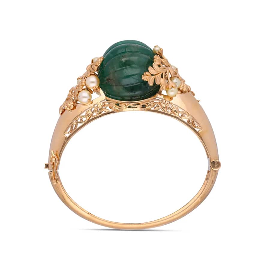 Elegant Gold Bangle with Carved Jade and Pearl Accents