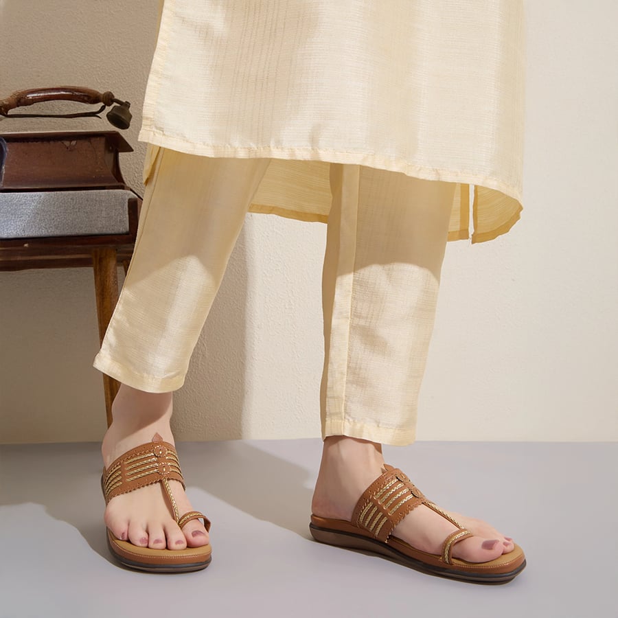 Tan ethnic embellished one toe flat sandals
