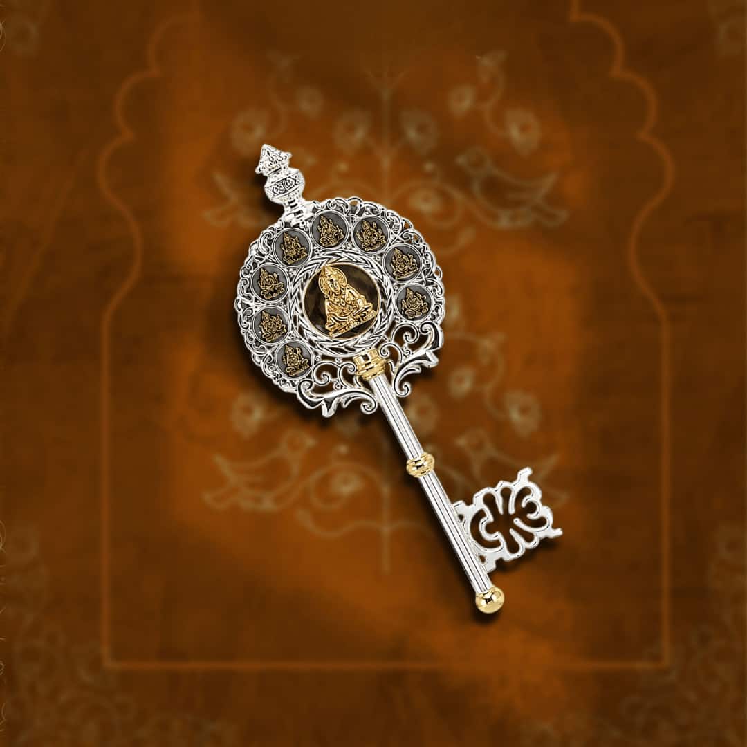 Silver kubera kunji key with intricate carvings for sacred rituals