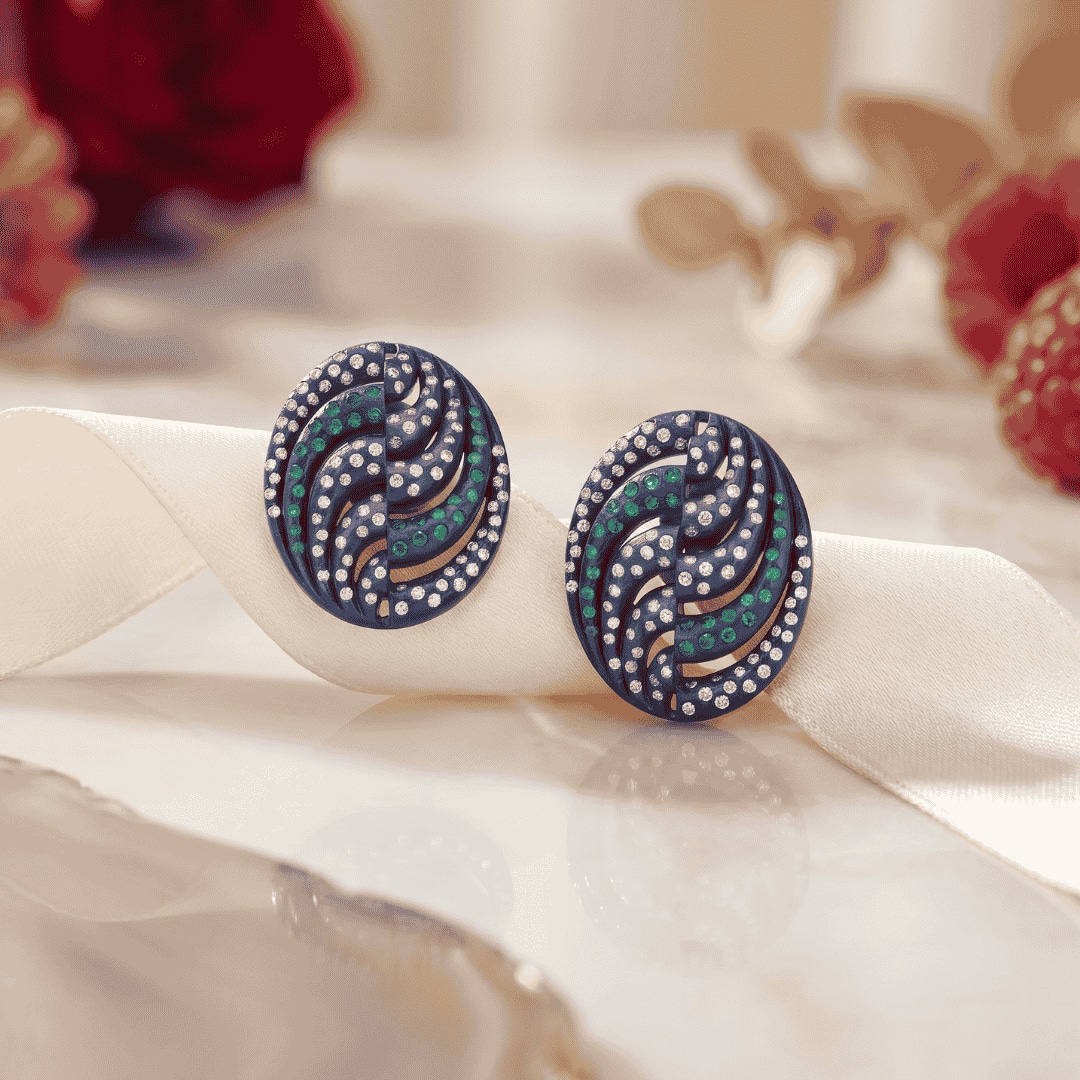 Titanium ear studs featuring oval shaped enamel artistry with diamonds