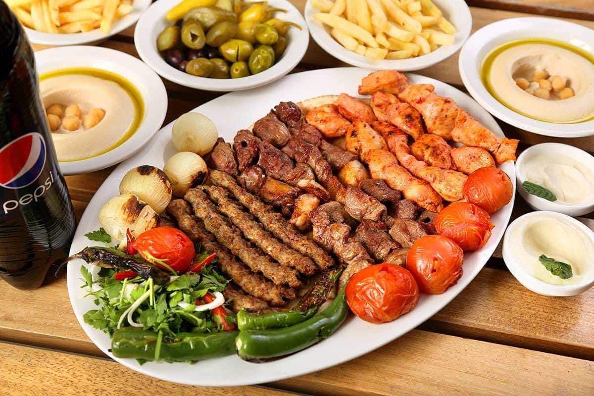 1 kilo mix grill served with hommos , veg and fries - Picture of Shams Al  Sham Restaurant, Ajman - Tripadvisor