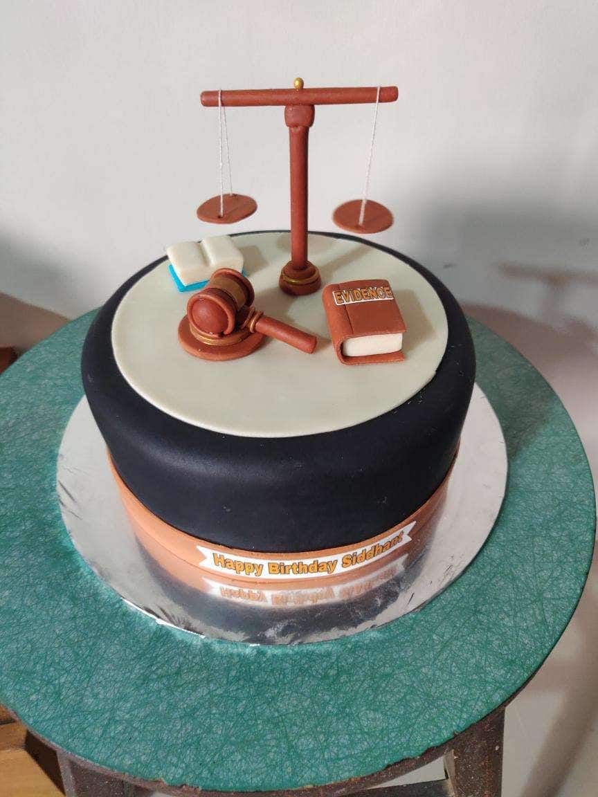 Cake Kraftt udaipur - Creating a balance of taste and look☺️ Cake for a  judge #judgecakes #birthdayfun #birthdaycake🎂 #fondanttopper #fondantart  #redvelvetcake #red #sharpedgescake | Facebook