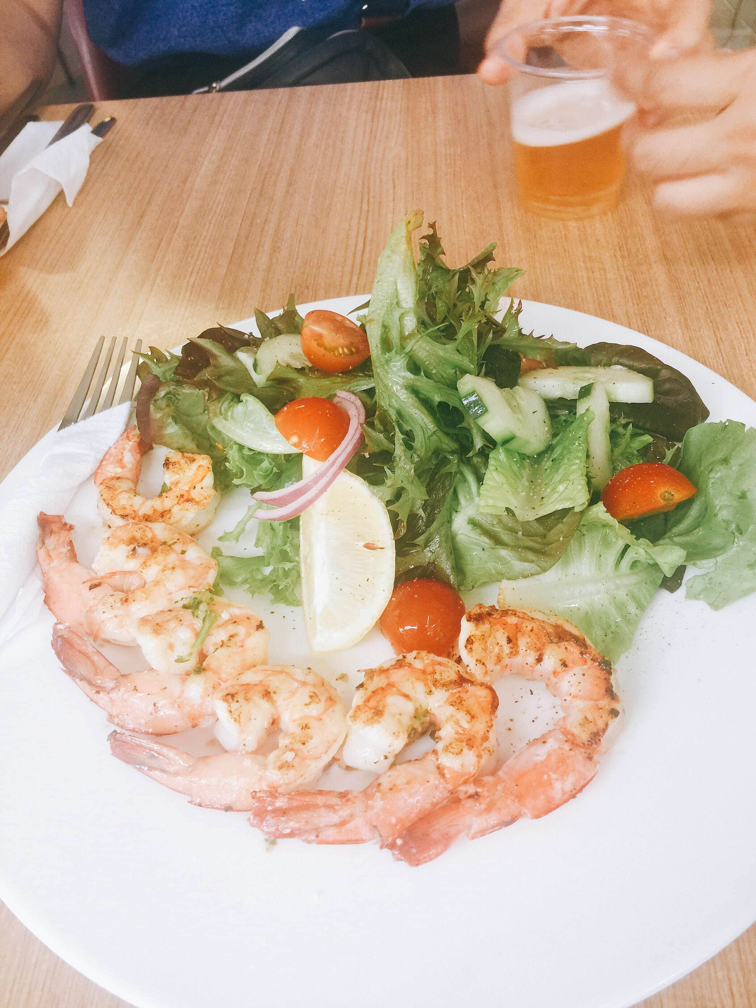 Fish and chips served in paper on a table at Bobby’s, a popular fish and chips and seafood snack Fish and chips served in paper on a table at Bobby’s, a popular fish and chips and seafood snack